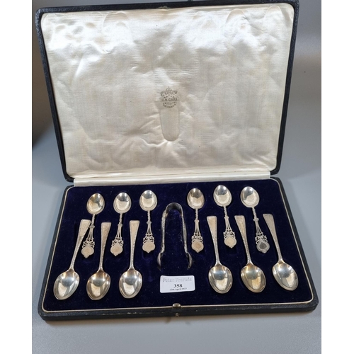 358 - Large cased set of silver tea spoons, two sets of six and a pair of sugar nips.  London hallmarks.  ... 