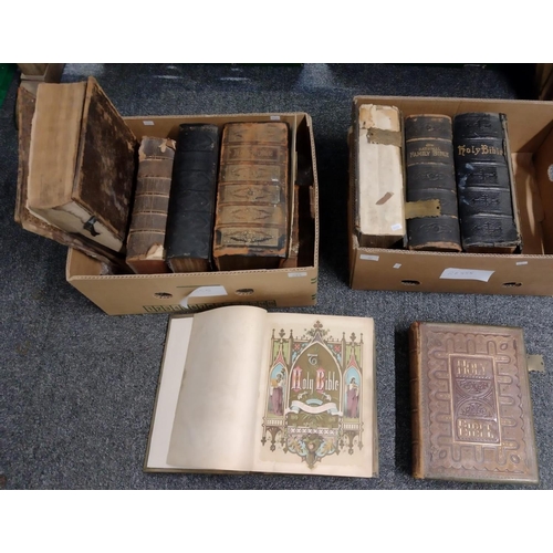 384 - Two boxes of large antiquarian leather bound hardback Bibles. Some with gilt decoration and marbled ... 