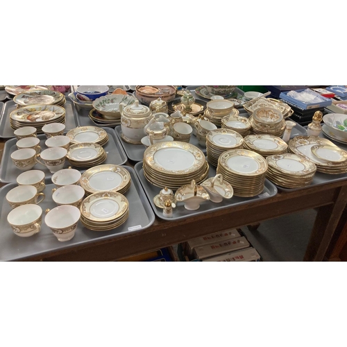 434 - Six trays of Noritake porcelain Japanese tea and dinnerware items on a white ground with gilded bouq... 