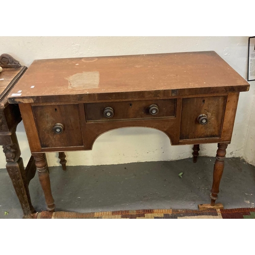 559 - 19th century mahogany low boy, the moulded top above an arrangement of three drawers with arched cen... 