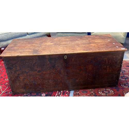 581 - Large 19th century pine trunk with poker work front panel.   (B.P. 21% + VAT)