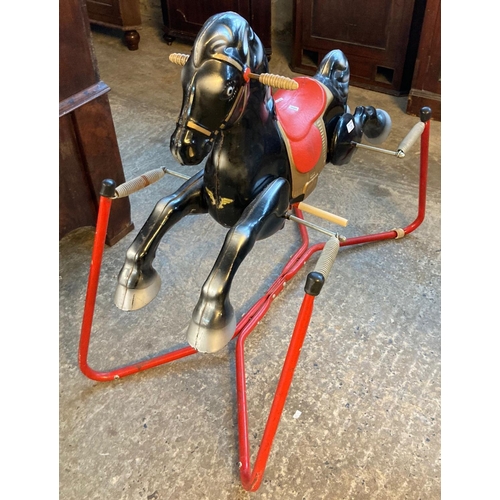 595 - Mobo type child's metal rocking horse on tubular sprung stand.   (B.P. 21% + VAT)