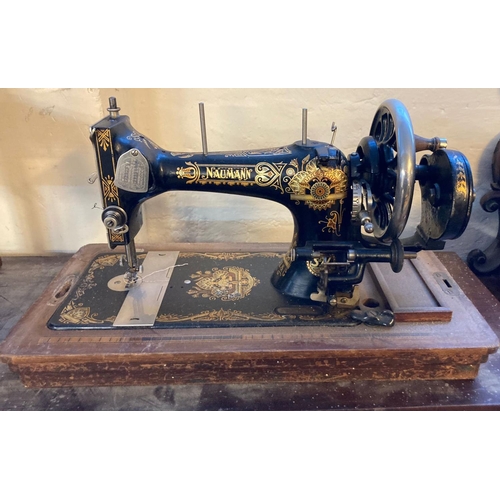 604 - Naumann hand sewing machine with wooden cover.   (B.P. 21% + VAT)