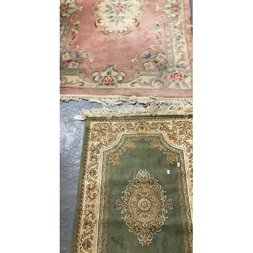 628 - Pink ground Chinese wash rug.  185x118cm approx, together with a Middle Eastern Design green ground ... 