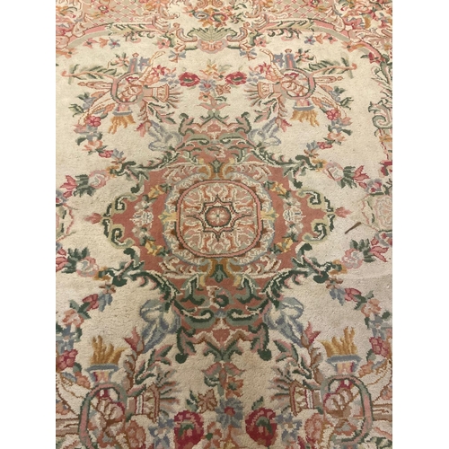 629 - Large Indian cream ground foliate decorated carpet.  385x197cm approx.   (B.P. 21% + VAT)