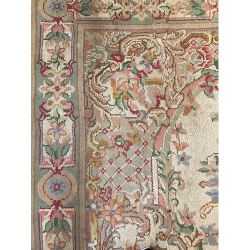 629 - Large Indian cream ground foliate decorated carpet.  385x197cm approx.   (B.P. 21% + VAT)