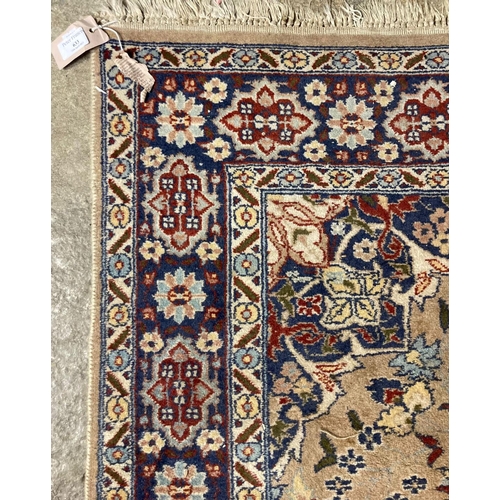 633 - Middle Eastern beige ground foliate design rug.  180x127cm approx.   (B.P. 21% + VAT)