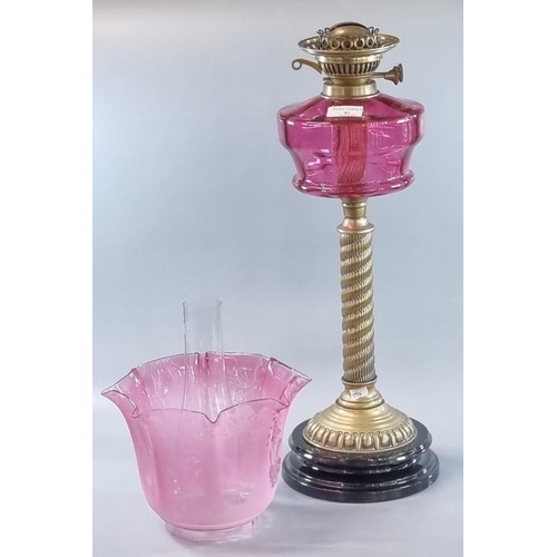 82 - Early 20th century double oil burner lamp having clear and frosted etched cranberry glass foliate sh... 