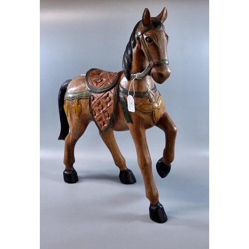 86 - Modern carved hardwood and painted study of  a horse. Possibly European.  57cm high x 44cm long appr... 