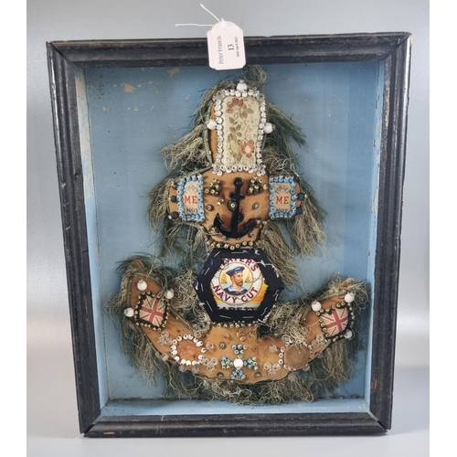 13 - Cased anchor shaped Sailor's Valentine, overall decorated with printed panels, studs, tassels and an... 