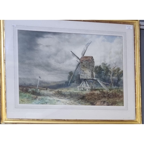 133 - Samuel Henry Baker (British 1824-1909), a moorland byway with ancient windmill and figure, signed.  ... 