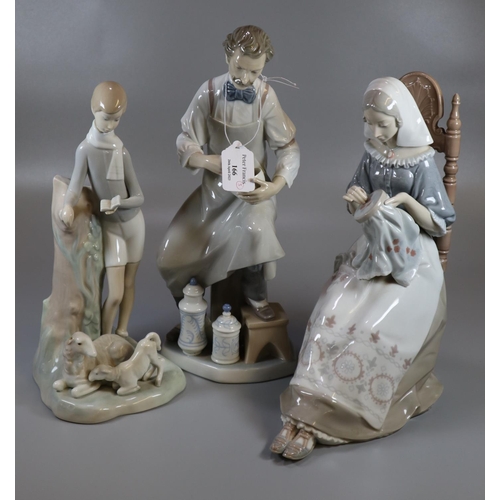 166 - Three Lladro Spanish porcelain figurines to include: 19th Century chemist, girl with book and lambs ... 