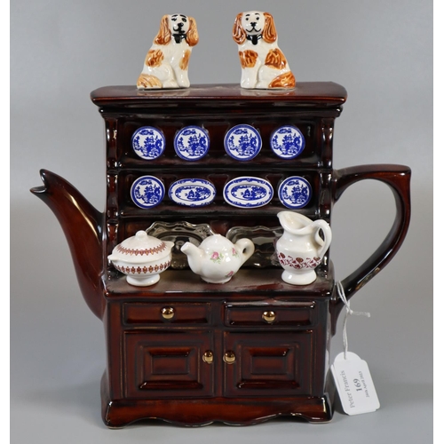 169 - Novelty pottery brown glazed teapot in the form of a dresser. 
(B.P. 21% + VAT)