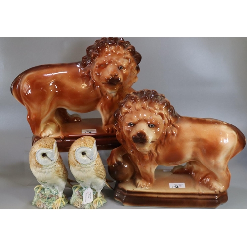 174 - Two Beswick 1046 barn owls, together with a pair of early 20th Century Staffordshire pottery standin... 