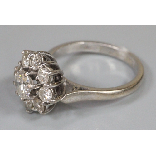236 - Diamond cluster ring set in 18ct white gold.  The central brilliant cut diamond an estimated 0.52cts... 