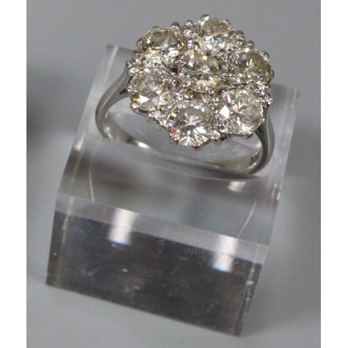 238 - Large diamond cluster ring set in 18ct white gold.  The brilliant cut diamonds an estimated total di... 