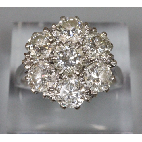 238 - Large diamond cluster ring set in 18ct white gold.  The brilliant cut diamonds an estimated total di... 