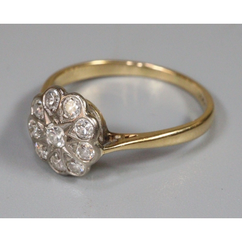 240 - 18ct gold diamond daisy/flower head ring, 2.8g approx.  Ring size P.  (B.P. 21% + VAT)