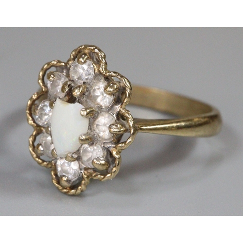 241 - 9ct gold opal flower head ring, 3.1 g approx.  Ring size P. (B.P. 21% + VAT)