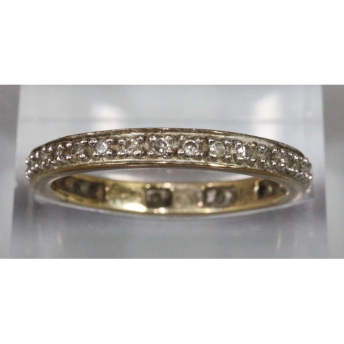 242 - 9ct gold diamond eternity ring, 2.1g approx.  Ring size O+1/2.  (B.P. 21% + VAT)