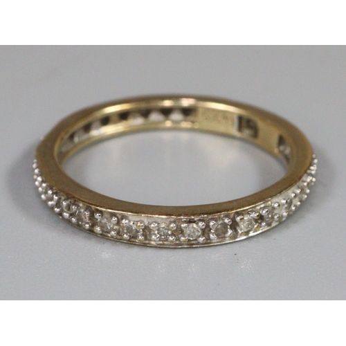 242 - 9ct gold diamond eternity ring, 2.1g approx.  Ring size O+1/2.  (B.P. 21% + VAT)