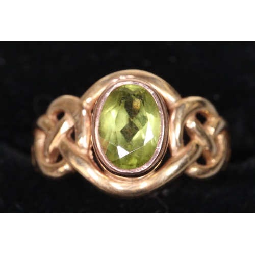 245 - 9ct gold Peridot ring, 2.4g approx.  Ring size J.  (B.P. 21% + VAT)