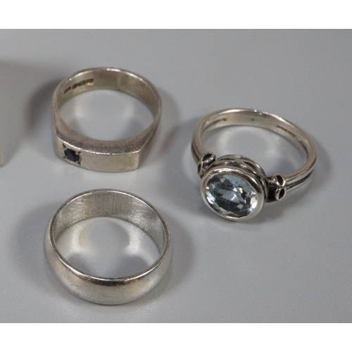 247 - Three assorted silver rings, one set with blue stone. (3)  (B.P. 21% + VAT)