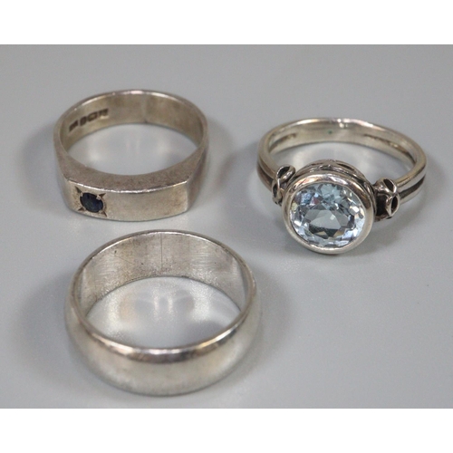 247 - Three assorted silver rings, one set with blue stone. (3)  (B.P. 21% + VAT)