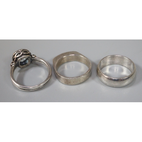 247 - Three assorted silver rings, one set with blue stone. (3)  (B.P. 21% + VAT)