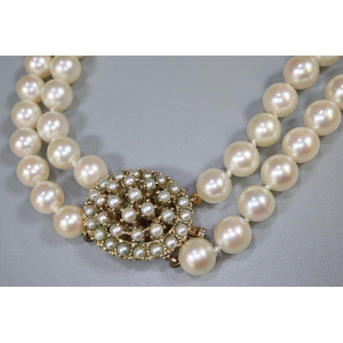 248 - A double row cultured pearl necklace with 9ct gold pearl set clasp.  Length 25 inches.
(B.P. 21% + V... 