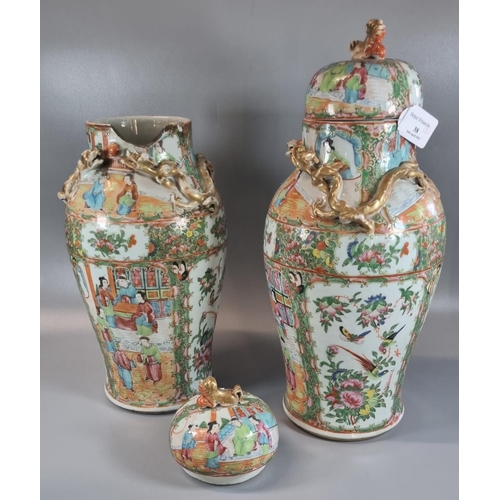 38 - Pair of Canton famille rose baluster vases and covers, decorated all over with panels of figures in ... 