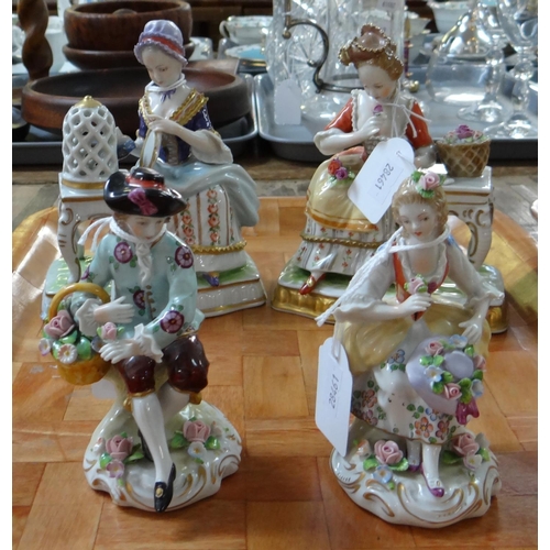 383 - Pair of continental porcelain figurines of a man and woman in 18th century dress with basket of flow... 