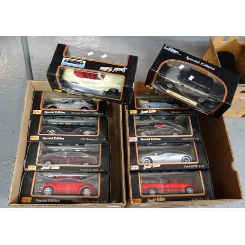 406 - Two boxes Maisto 1:18 scale diecast model vehicles, all in original boxes, to include: Jaguar XK8, F... 