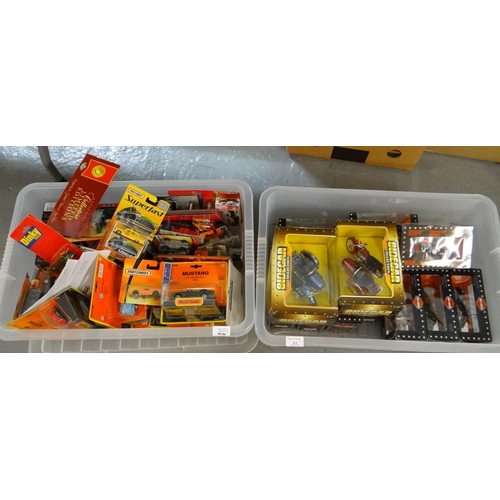 414 - Two plastic boxes of assorted diecast model vehicles all appearing in original boxes, to include: Di... 