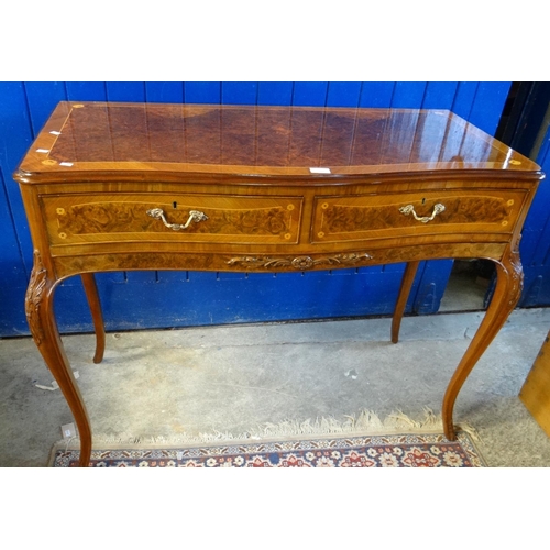 522 - French design mixed woods serpentine two drawer side table overall decorated with flowers and carved... 