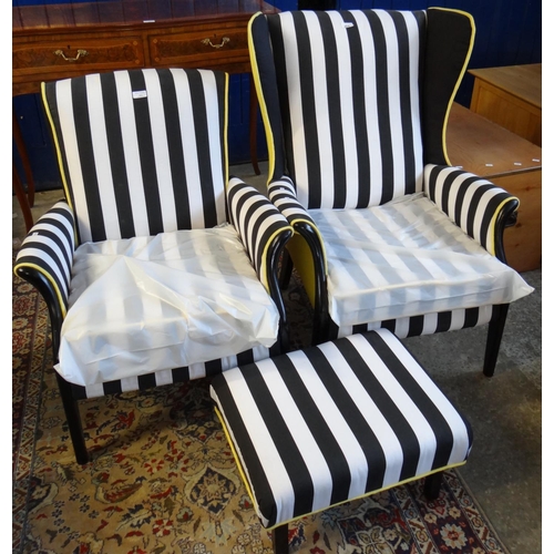 523 - Two Parker Knoll armchairs newly upholstered with Zebra design together with a matching foot stool. ... 