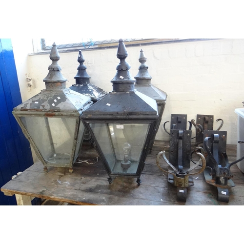 527 - Four Victorian style lanterns with glass panels of large proportions, together with four mounting/wa... 