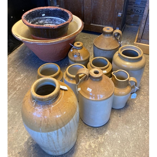 562 - Collection of stoneware items, to include: flagons, utensil jars, mainly appearing unmarked together... 