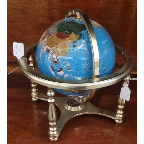 83 - Modern chrome finish and hardstone revolving table globe.
(B.P. 21% + VAT)