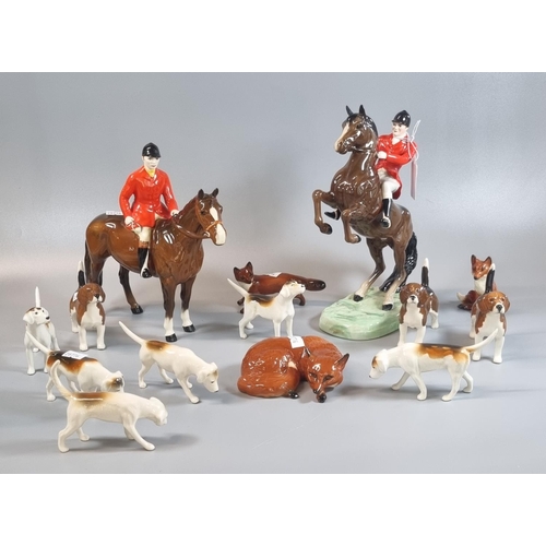 19 - Beswick hunting group, to include: 868 horse and huntsman, another horse and seated huntsman, hounds...