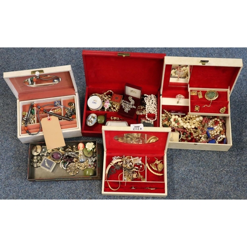 202A - Four jewellery boxes and another box comprising assorted costume jewellery to include: cufflinks, br... 