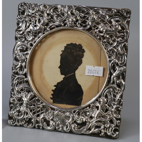 208 - Art Nouveau easel  silver picture frame embossed with cherubs and silhouette of a Victorian lady.  (... 