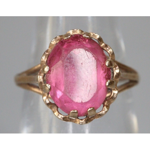 224 - Yellow metal pink stone ring, size I 1/2, 2.2g approx.  (B.P. 21% + VAT)