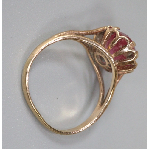 224 - Yellow metal pink stone ring, size I 1/2, 2.2g approx.  (B.P. 21% + VAT)