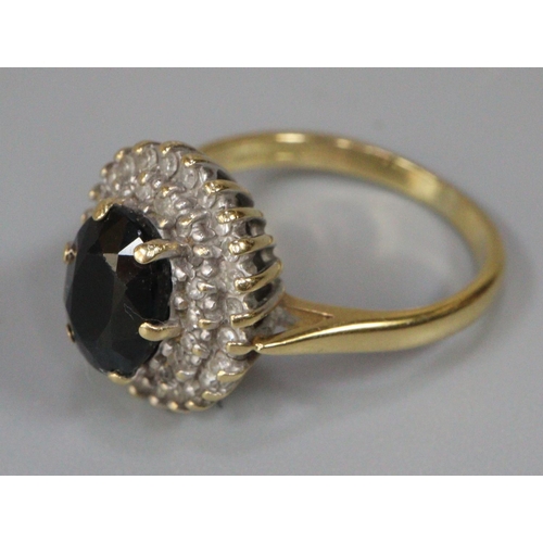 228 - 18ct gold Sapphire and diamond cluster ring.  (B.P. 21% + VAT)