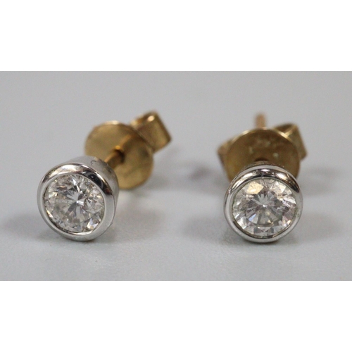 245 - 9ct gold diamond pair of stud earrings.  1g approx.  (B.P. 21% + VAT)