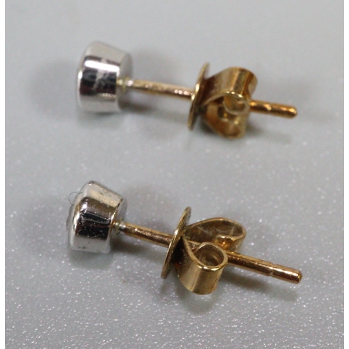 245 - 9ct gold diamond pair of stud earrings.  1g approx.  (B.P. 21% + VAT)