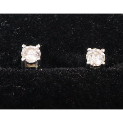 246 - Pair of 9ct white gold diamond stud earrings.  (B.P. 21% + VAT)