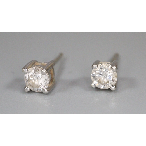 246 - Pair of 9ct white gold diamond stud earrings.  (B.P. 21% + VAT)