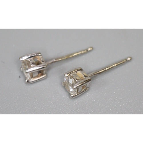 246 - Pair of 9ct white gold diamond stud earrings.  (B.P. 21% + VAT)